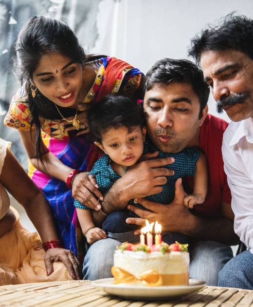 Indian family celebrating a birthday party